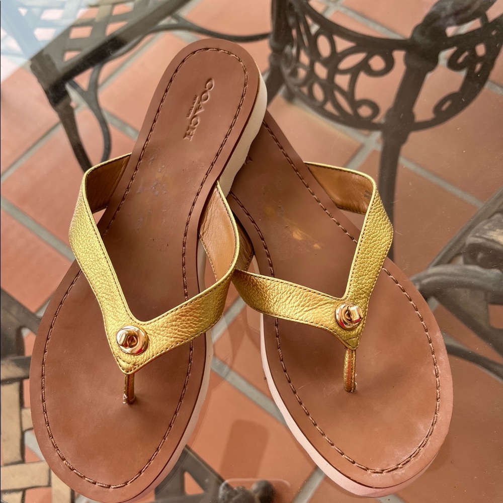 Coach 8.5 leather gold thong sandals.